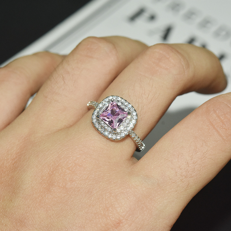Exquisite Pink Sapphire Halo Ring in Sterling Silver